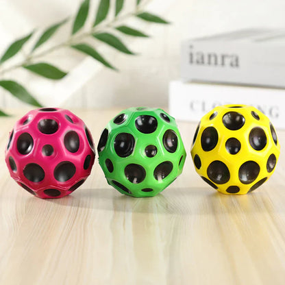 Assorted colorful bouncy balls with various patterns and designs